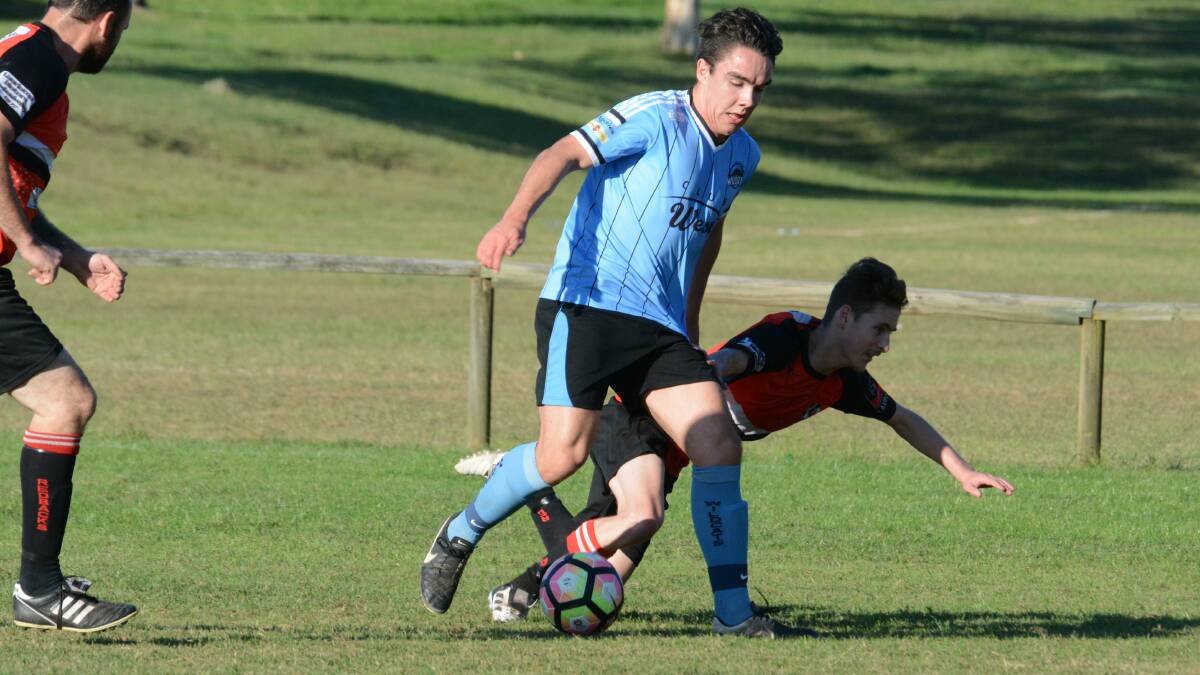 Taree's Lucas Mepham evades a defender during a Football Mid North Coast Premier League clash this season. The Wildcats meet Kempsey Saints at Kempsey on Saturday.