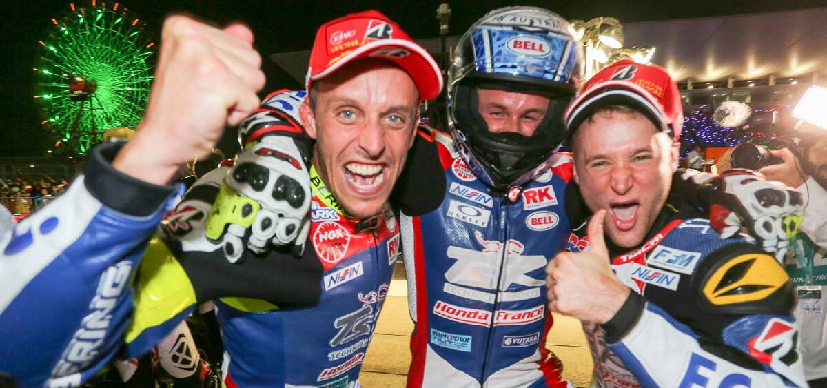 Josh Hook (centre) celebrates with team-mates after last year's World Endurance Championship win. His team is hoping to go back-to-back this weekend in Japan.