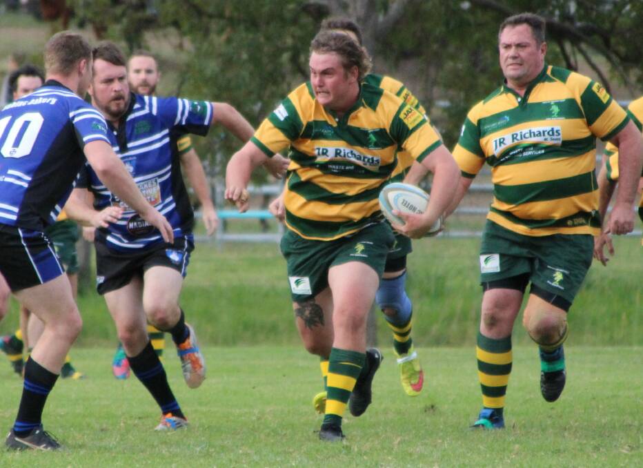 Forster-Tuncurry hooker Blake Polson charges through the Wallamba defence in the Lower North Coast Rugby Union clash at Nabiac. Photo Sue Hobbs.