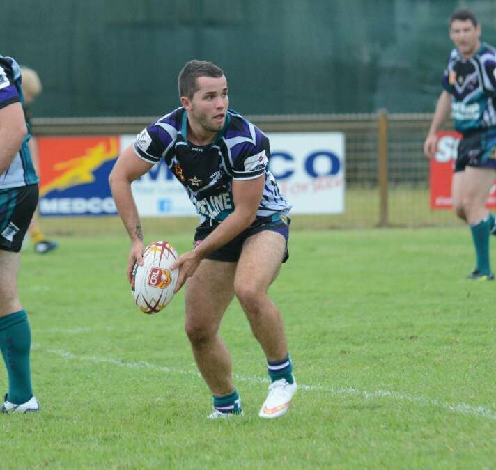 Mick Henry looks to offload to a support during his stint with Taree City. He returns to Old Bar next year as captain-coach.