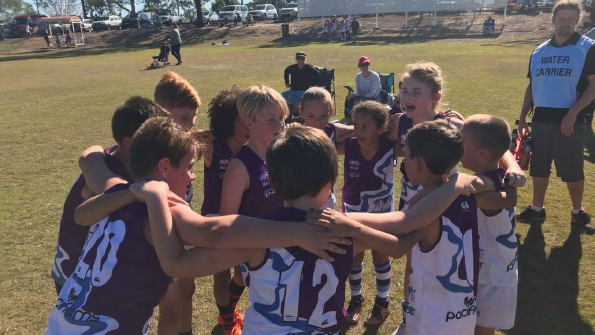 Manning 11s celebrate their win.