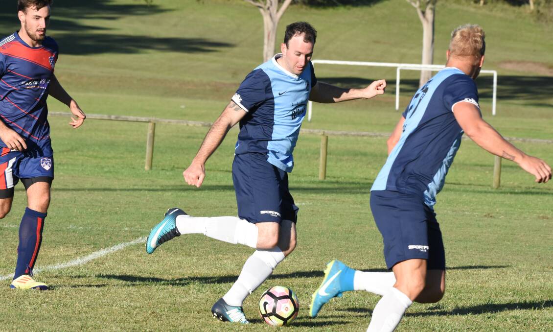 Taree's Ricky Campbell goes on the attack in the premier league clash against Wauchope at Omaru Park.