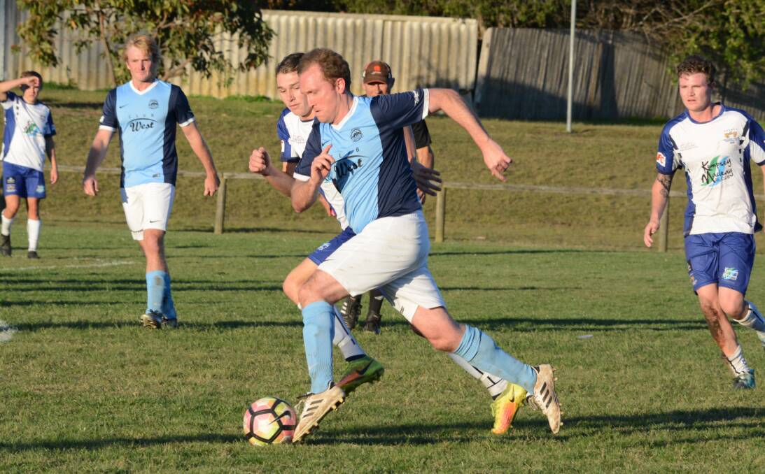 Justin Atkins goes on the attack for Taree in the clash against Macleay Valley.