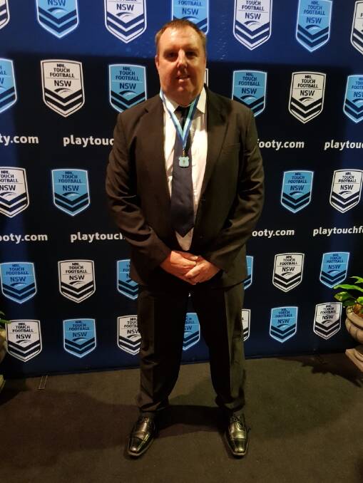 Taree Touch's Phil Rainger with the Rod Wise Medal at the NSW Touch award night.