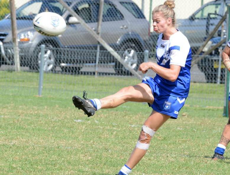 Larissa Ward kicking on for North Coast in a women's Country Championship game at Taree last year.