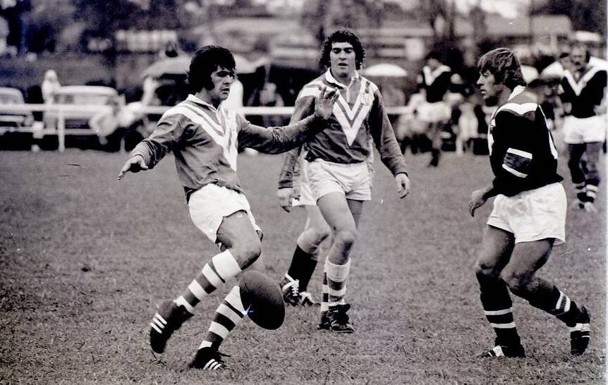 Mark Hogan watches as co-centre Peter Walkon kicks during the trial game against Easts in 1975. Hogan rates Walkom as among the best footballers of his era. Both Hogan and Walkom represented Country, Hogan in 1974, Walkom in 75.