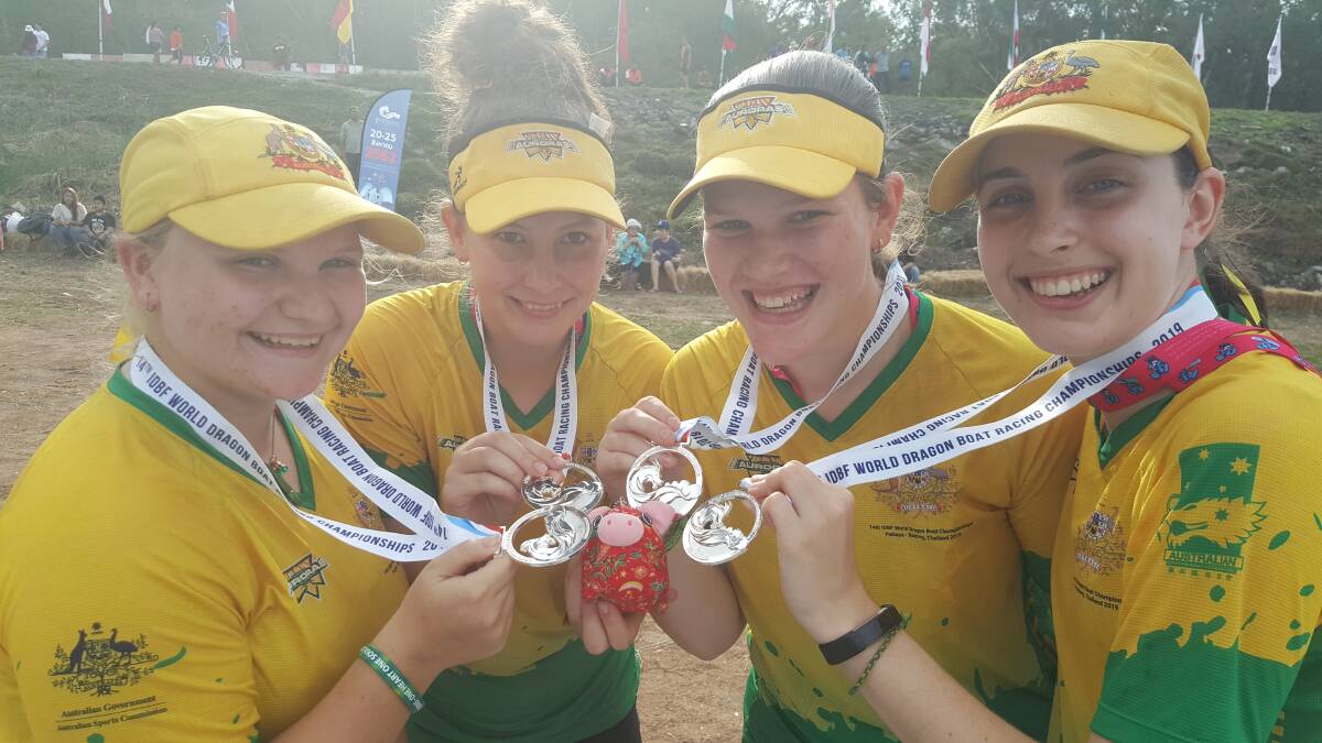 Jade Page (second from the right) and team-mates celebrate winning a silver medal at the World Dragon Boat Championships in Thailand. 