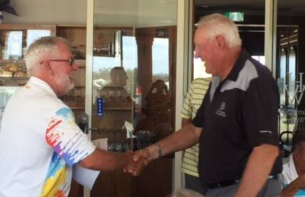 Harrington Waters GC president Peter Budden congratulates Tuncurry's Gary Cush after he won the over 65 gross with 74.