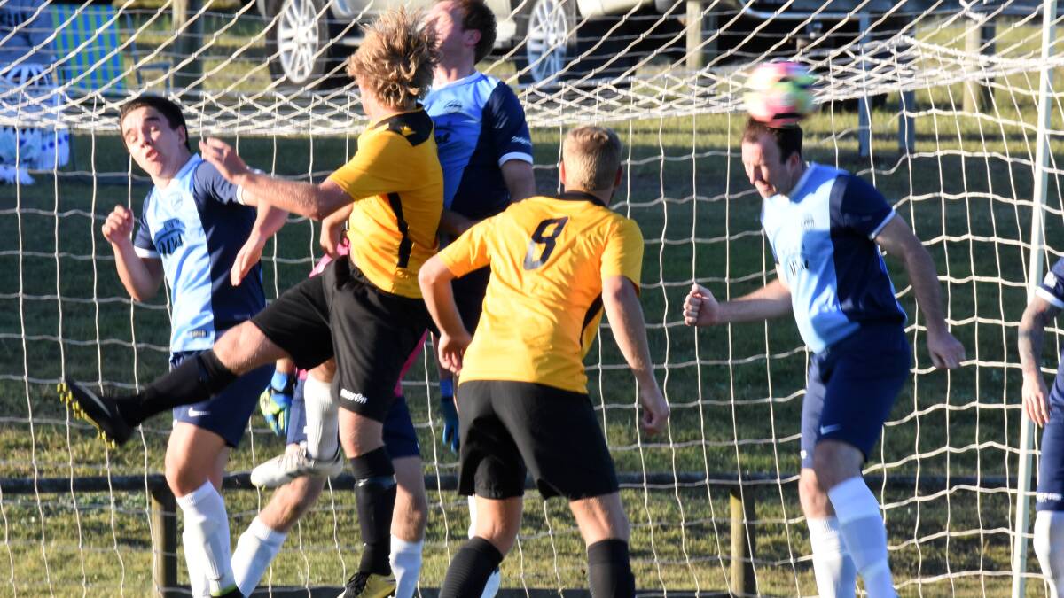 Action in the goal mouth during a Taree-Tuncurry Forster Football Mid North Coast Premier League clash last season. Both clubs have expressed concerns about the proposed coastal premier league set to start next year.