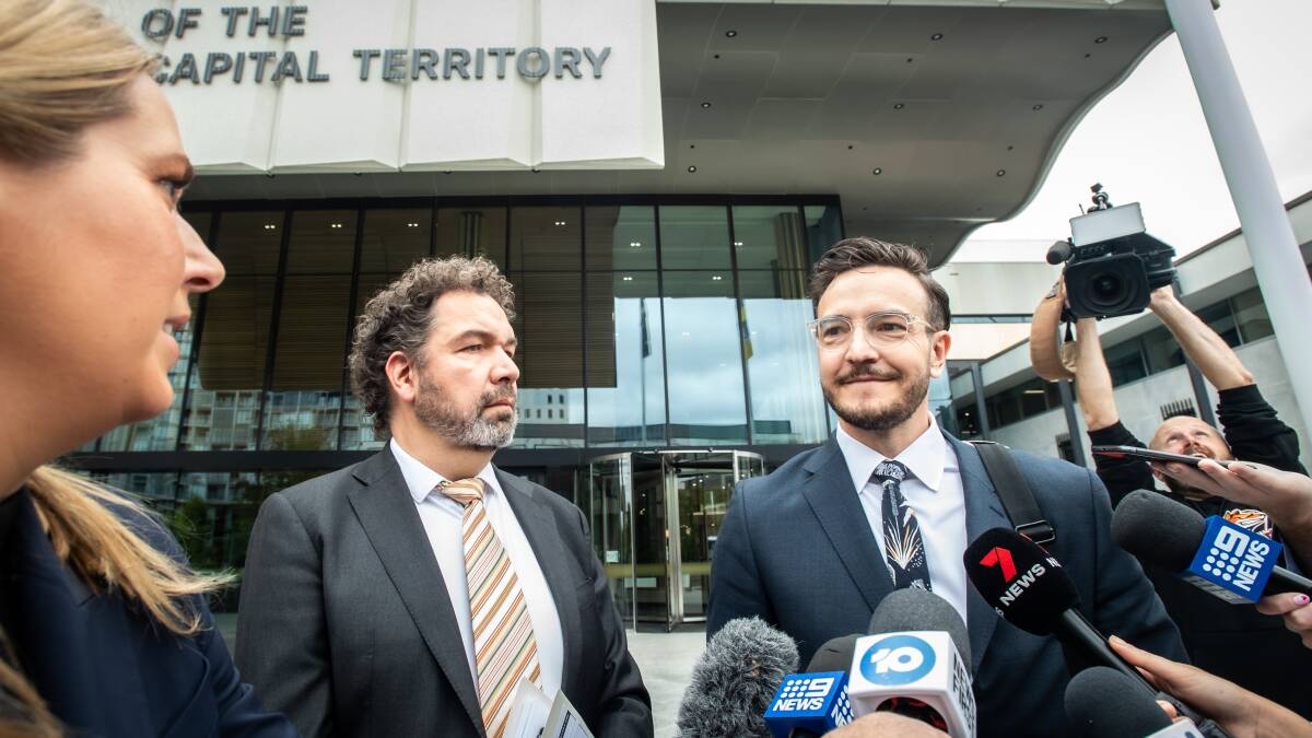 The NRL stars' solicitors, Maarten Vlot and Tom Taylor, front news cameras outside court. Picture by Karleen Minney