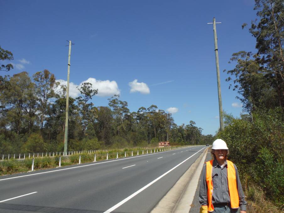 Success story: Professor Ross Goldingay with glider poles on the Oxley Highway, Port Macquarie. Photo: supplied