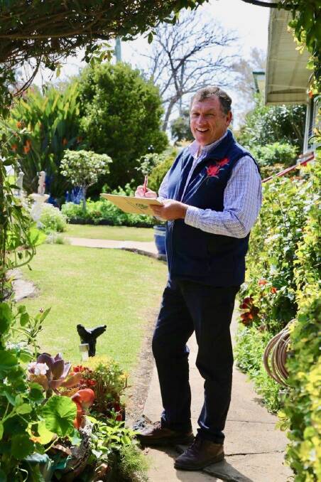 George Hoad judging gardens at the Toowoomba Carnival of Flowers. Photo supplied