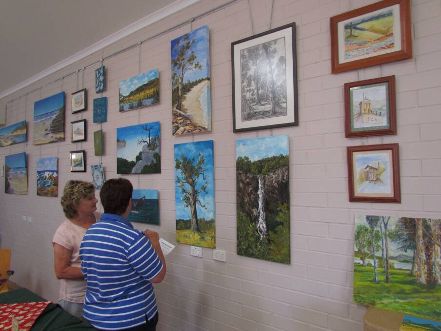 Lorraine Kyle and Rosslyn Figg enjoying the Art and Soul Exhibition at Taree Craft Cottage.