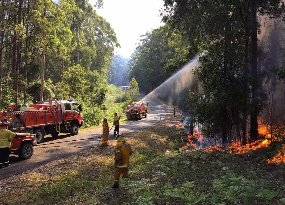 Rural fire brigades, including Coopernook, fighting the fire on Middle Brother. Photo supplied by Coopernook RFS