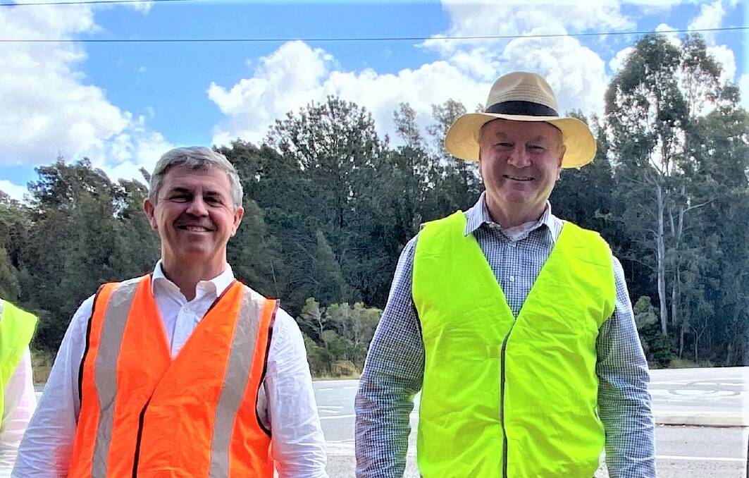 Lyne MP David Gillespie and Myall Lakes MP Stephen Bromhead in site of the highway upgrade north of Taree. Photo supplied.