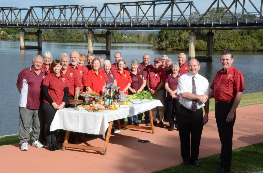 Taree Lions president Phil Grisold and Taree businessman Graham Brown plus club members in a photo promoting TasteFest.