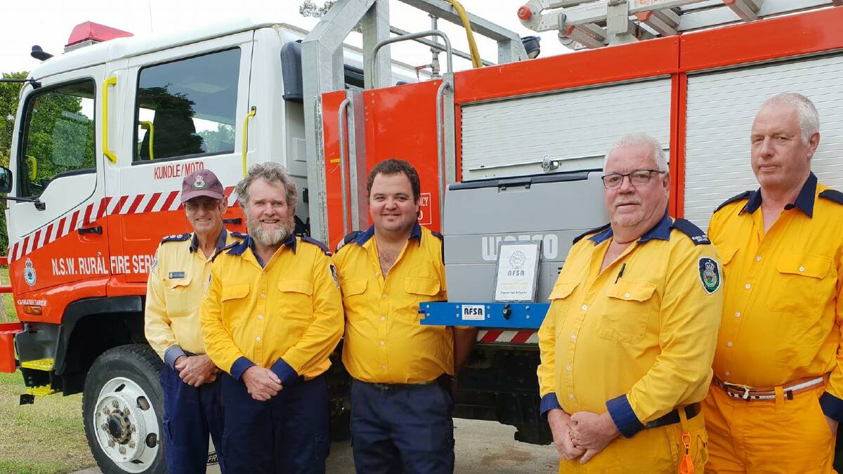 Kundle/Moto Brigade members Arthur Southwell, Peter Longworth, Nick Wright, Kevin Organ and Peter Wiss pose with the NSW RFSA grant.