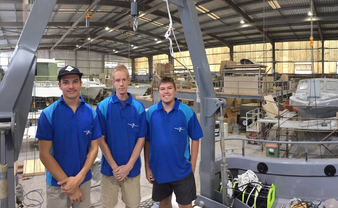 Apprentices Beau Paff, Ben Shannon and Chris Ellis in the busy fit-out bay at Steber’s
Taree factory complex. 
