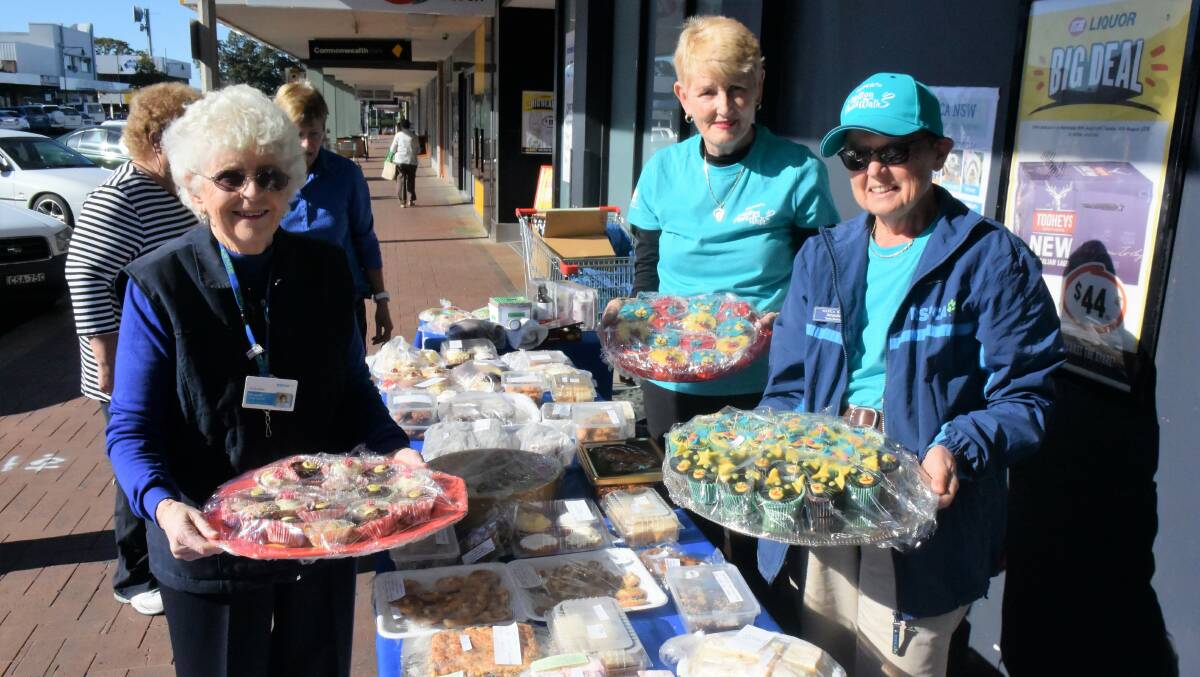 RSPCA supporters Margaret Savage, Jan Swift and Amanda Brooks at the cupcake stall in Manning Street, Taree.