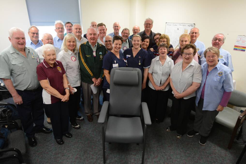 Lions club representatives and hospital staff celebrate the donation of 12 Comfort Fusion Chairs.