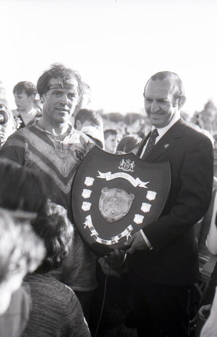 United we stand: Taree United captain-coach Ron Boden with the Group Three Rugby League premiership shield after the 1971 grand final win over Old Bar.