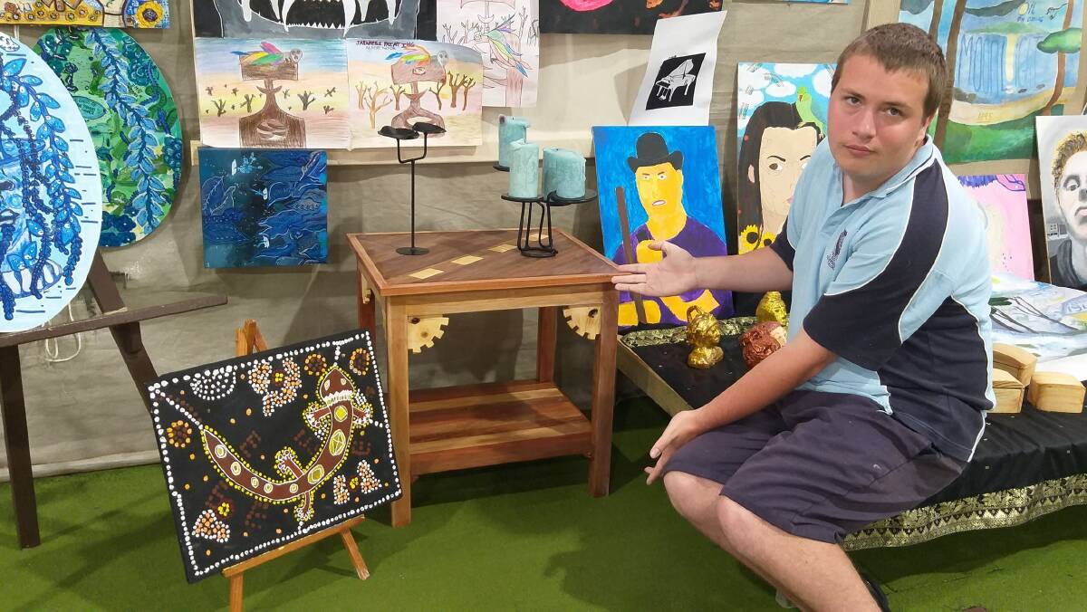 Bulahdelah Central School student Harrison Hughes with some of the works on show.