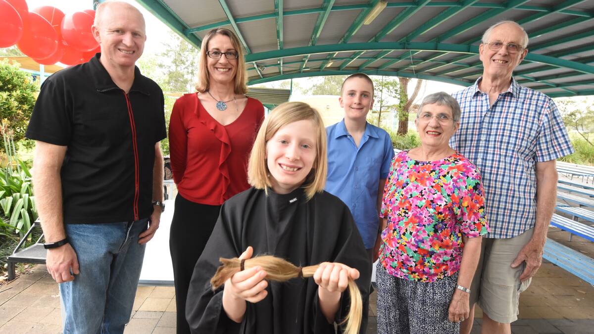 St Joseph's student Flynn Small with his parents Scott and Janelle Small, brother Leo and grandparents Grace and John Perkins after his chop.