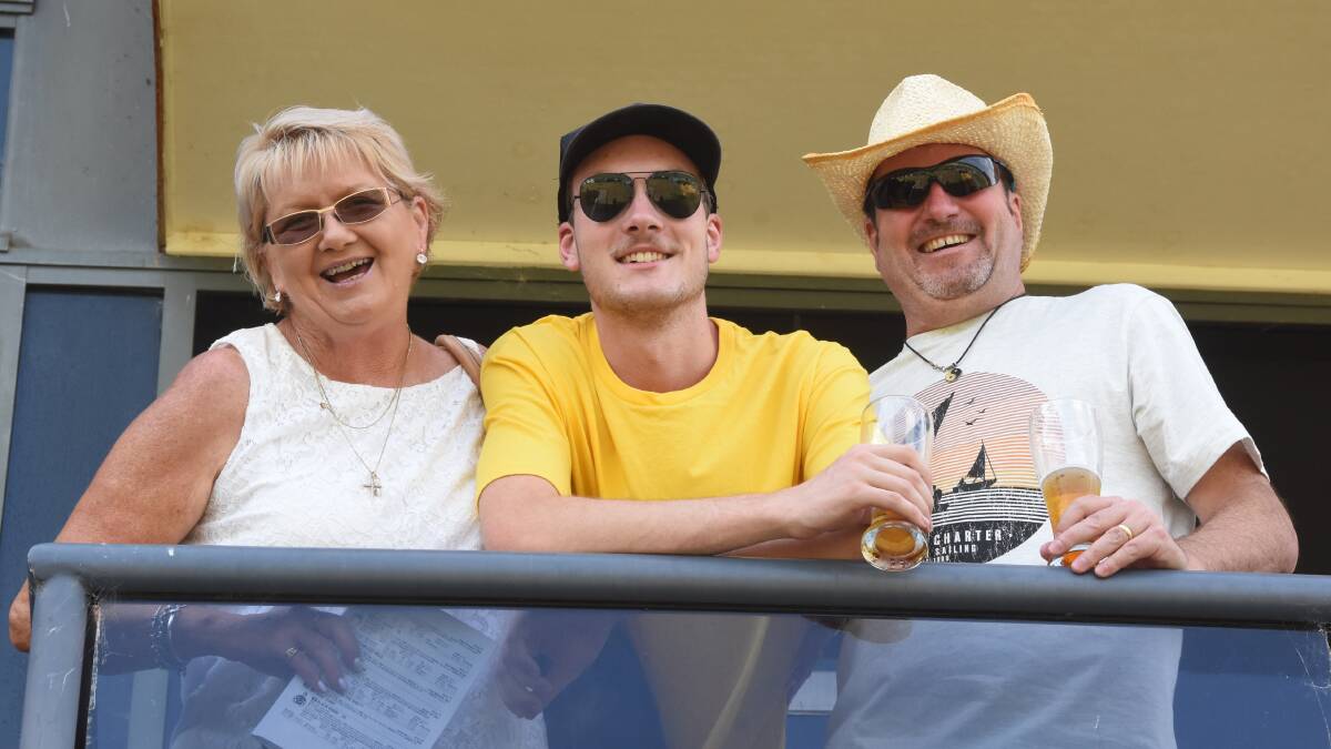 A warm day at the races: Paula Morris with Craig and Jack Nelson at Manning Valley Race Club's TAB meeting on Monday, January 14.