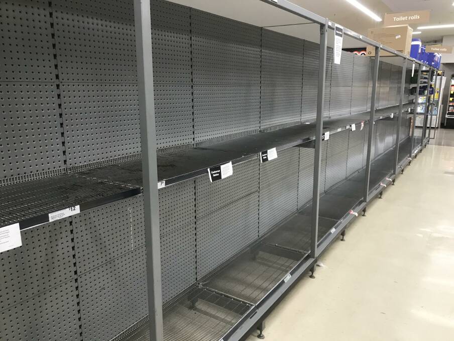 Nothing left: Taree shoppers wiped out shelves of toilet paper in Woolworths earlier this month. Some people believe the coronavirus will cause toilet paper shortages nationwide.