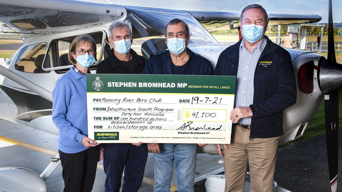 Members of the Manning River Aero Club, Kerry Nolan, Gary Tonkin and Russell Jones are presented with an Infrastructure Grants Program cheque for $41,100 from local member Stephen Bromhead. Photo Ashley Cleaver/Cleavers Images