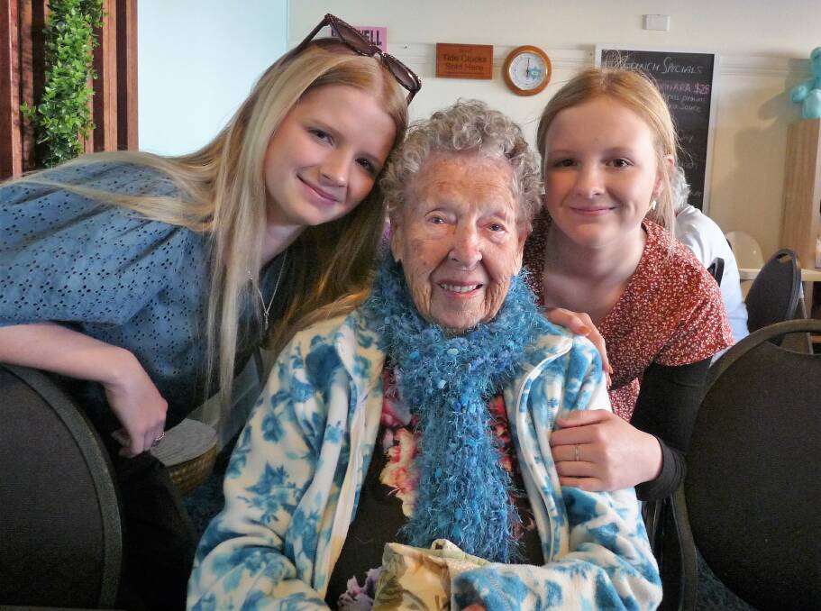 Doreen Prebble OAM has another morning tea celebration for her 101st birthday with a surprise visit by two great granddaughters, Allee and Paige Silvester.