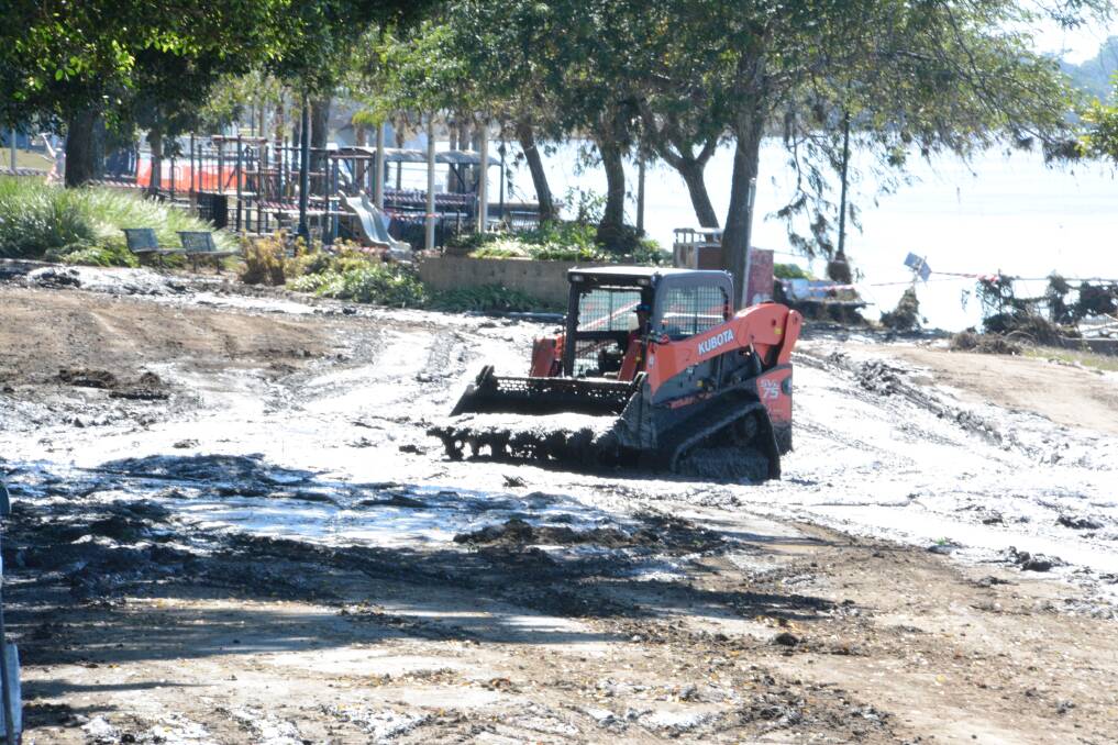 Silt and debris from this week's major flood event being removed from Queen Elizabeth Park, Taree.