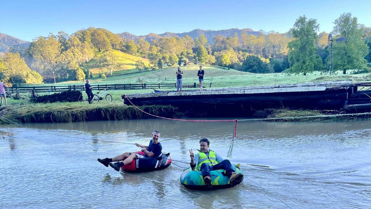 "Council going above and beyond floating across our bridges river to meet with locals and see the damaged three bridges on Mt Coxcomb Road." Photo Lyn Connors