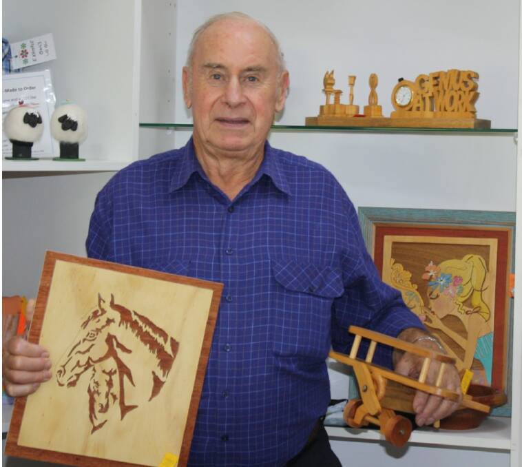 Wolfgang Bottcher with his work which is on show at Taree Craft Cottage.