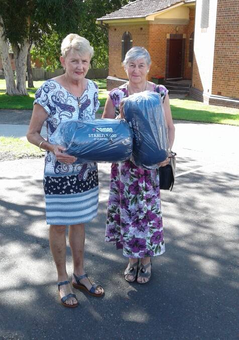 Taree North Rotary's Jan Swift and Cecily Minihan of St Vincent de Paul.