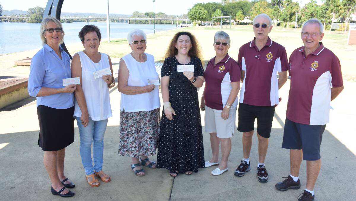 Duck race winners Kaye Pullen (fourth), Maureen West (third), Angela Bird (second) and Josephine Cook (first) with Lions president Di Booker, treasurer Ian Coutts and TasteFest committee member Allen Lenton.