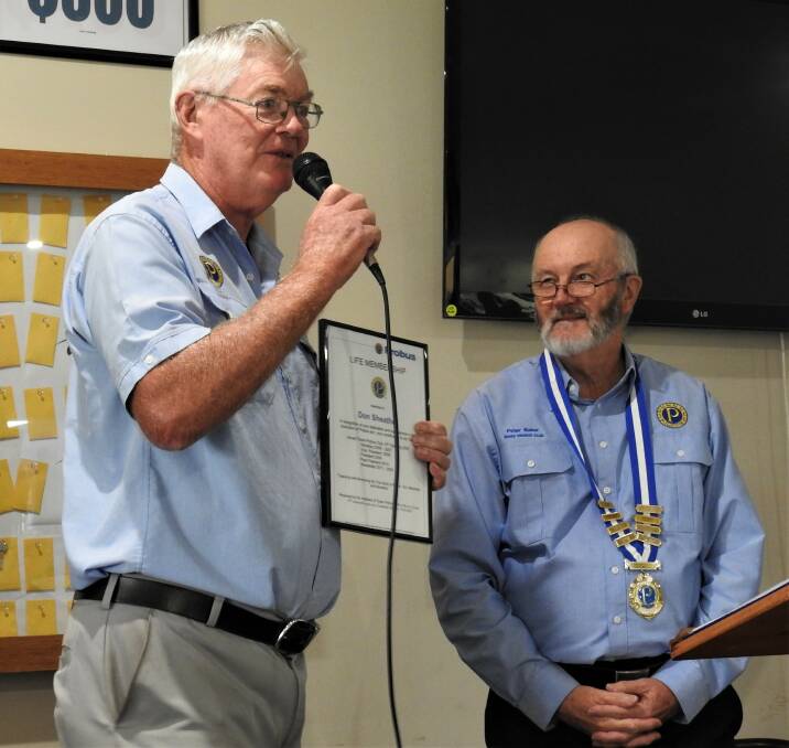 Don Sheather receiving his life membership award from president Peter Baker at the last Probus changeover in March this year..