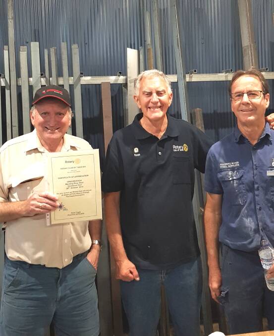 Taree Rotary president, Ross Tingle (centre) with representatives from Manning Valley Steel and Manning Profiling.