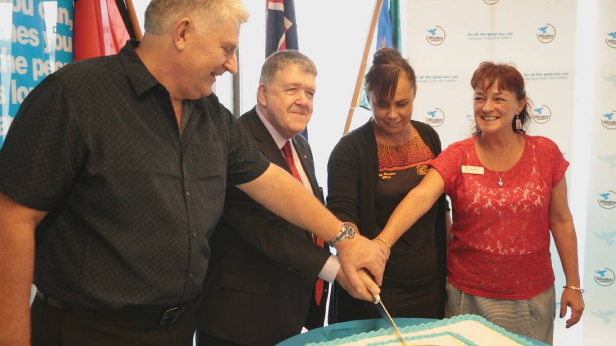Cutting the cake to celebrate the opening of Wesley Mission’s new community hub in Taree (from left): Mike Brunskill, Wesley Mission foster carer; the Rev Dr Keith Garner, CEO, Wesley Mission; Joedie Lawler, CEO, Purfleet Taree Local Aboriginal Land Council; Councillor Kathryn Bell, Mid-Coast Council.