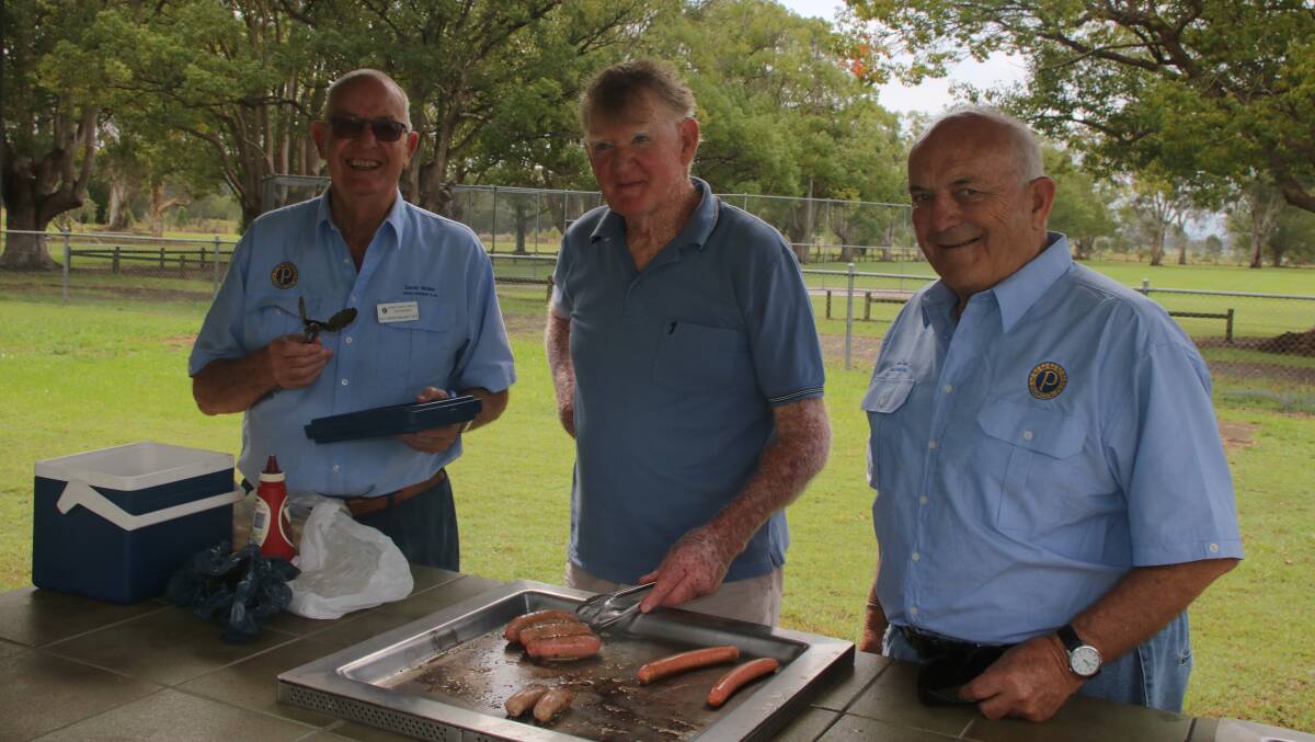 President's barbecue: Taree Probus's past president David Walker, Graham McMorrine, and new president John Ward.