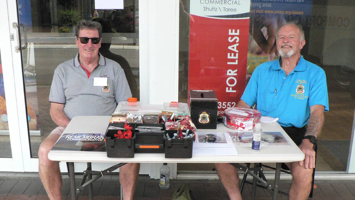 Sub-branch members Noel Campbell and Harry Sinclair manning the Remembrance Day stall.