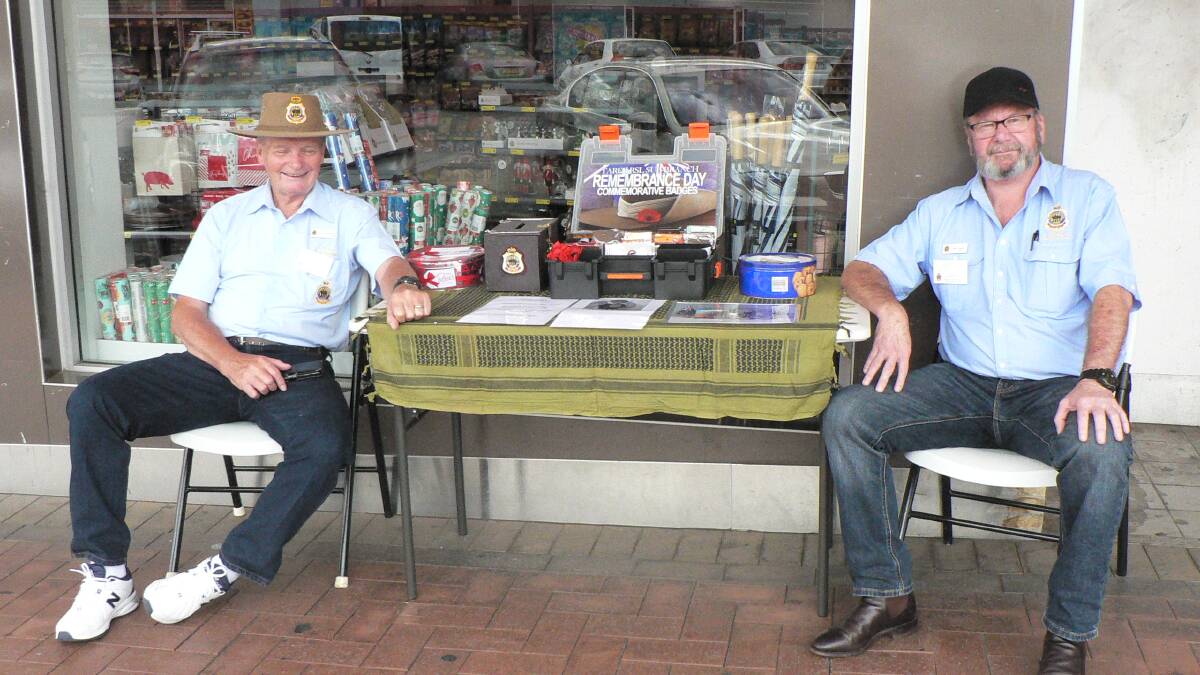 Taree sub-branch members Darcy Elbourne and John Connell on duty at the Remembrance Day stall.