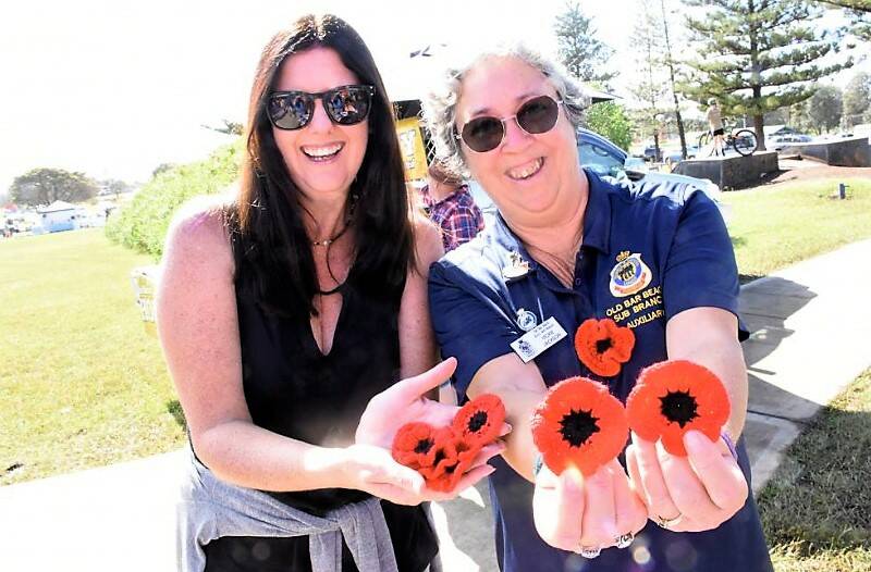 Old Bar RSL auxiliary coordinators Teresa Early and Vicki Jackson displaying the created poppies for Anzac Day.