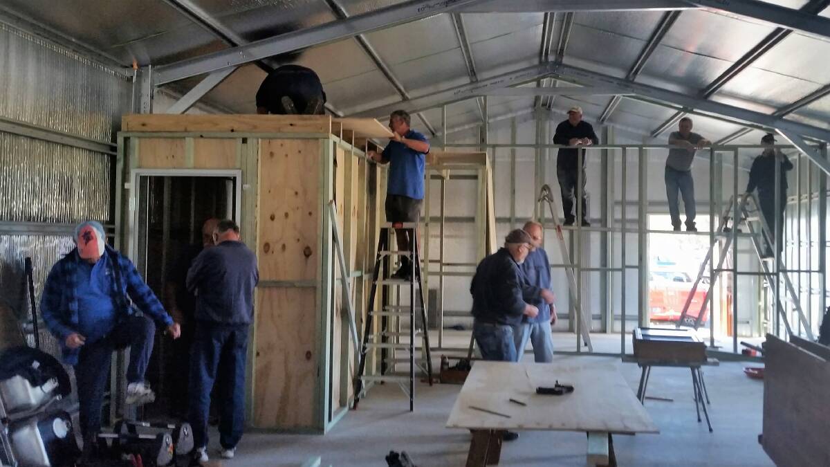 Old Bar Men's Shed members fitting out their new "home".