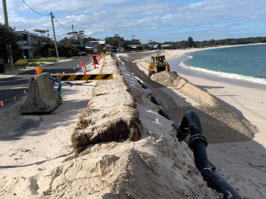 This photo, taken last Wednesday, July 22 shows council placing emergency sand onto the beach at the most critical points, after the first storm eroded the beach. This sand was still in place earlier this morning, Monday, July 27.