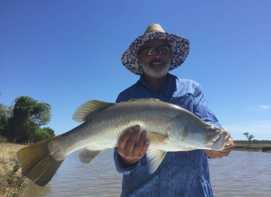 Arthur Poynting with a barramundi that he caught while fishing in Karumba. Photo Ros Poynting