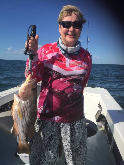 Ros Poynting with a finger mark (golden snapper) one of the many fish she caught while on her first fishing trip. Photo Arthur Poynting.