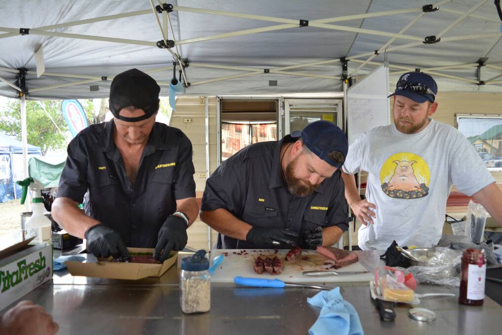 Matt Danton, Dion Allan and Peter Ashby from Comeatosed BBQ preparing a dish at the  Smokin the Valley Barbecue Competition. Photo Anne Keen