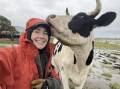 HIGHER GROUND: Belinda-Jane Davis with her cow Delilah after being moved to higher ground during the July flood. 