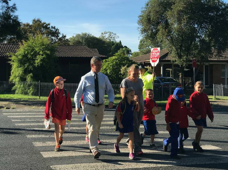 Dr David Gillespie walks to school with Manning Gardens students. 